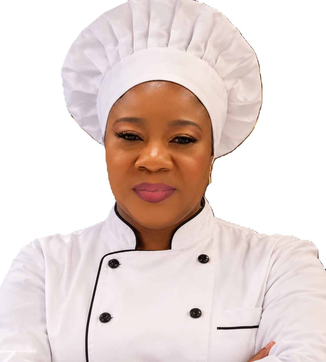 Funmi, founder and head cook of Fundel, in chef's whites with her arms folded